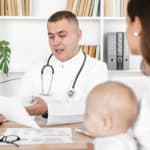 woman-with-baby-and-doctor-at-clinic
